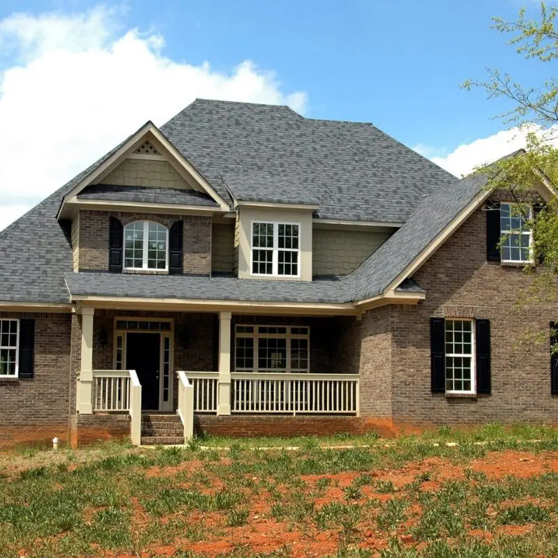 Two-story home with gray roof