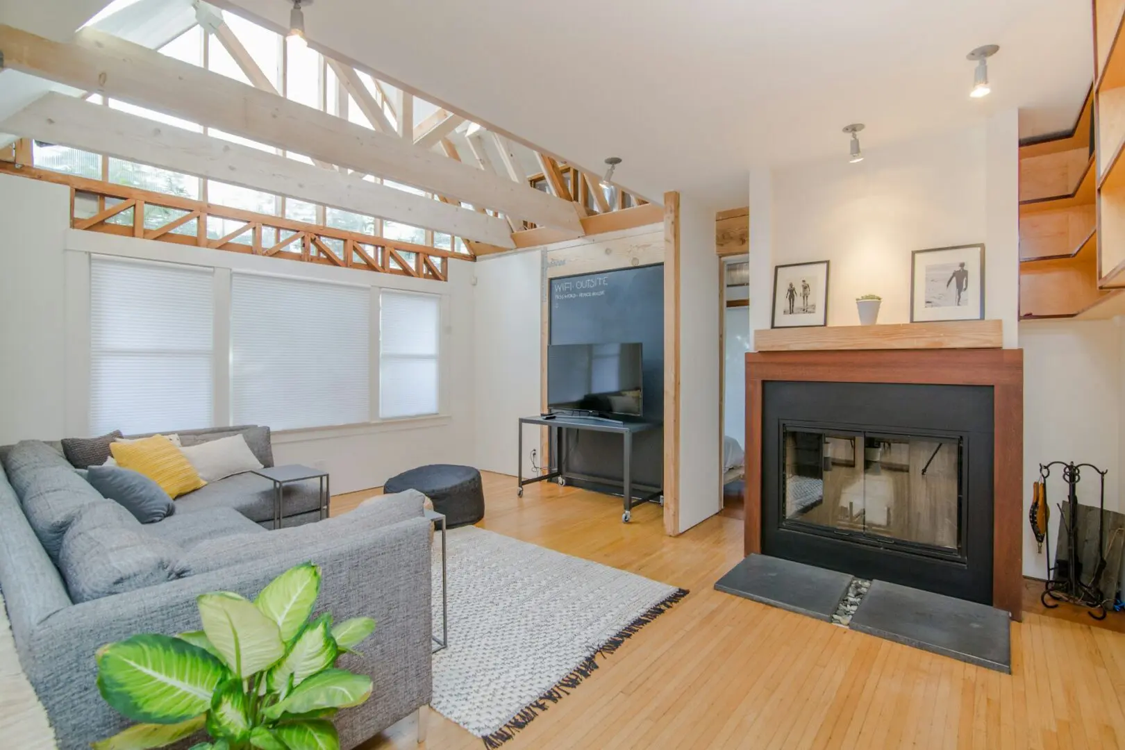 Bright room with wooden beams and couch