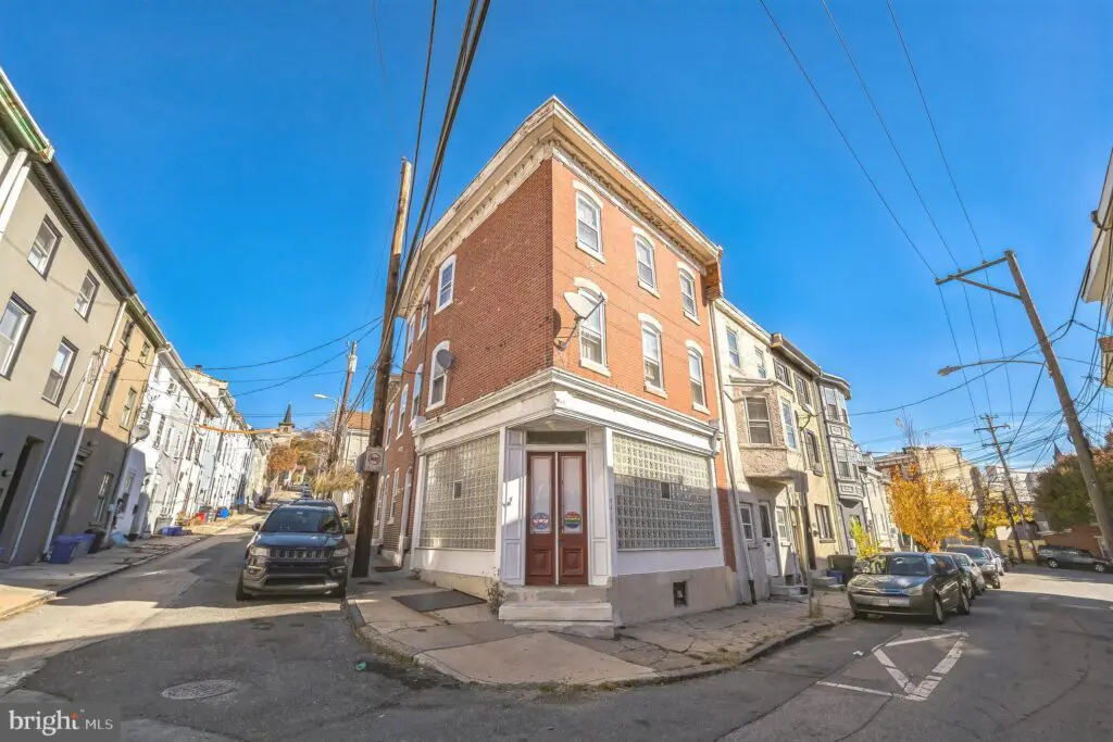 Three-story brick corner building at intersection
