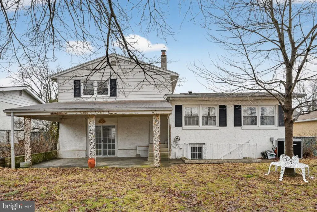 White split-level house with covered patio