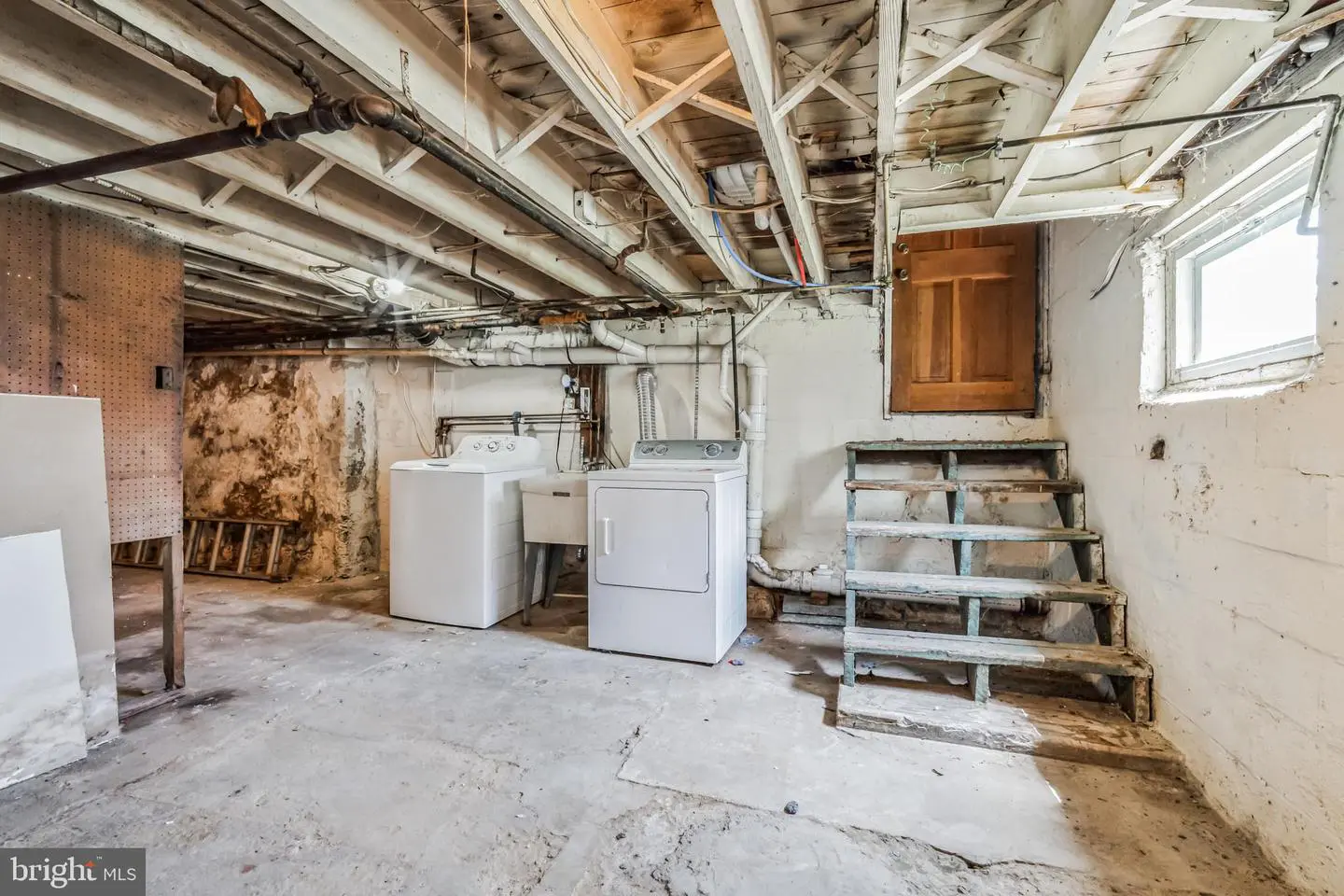 Basement laundry room with washer and dryer