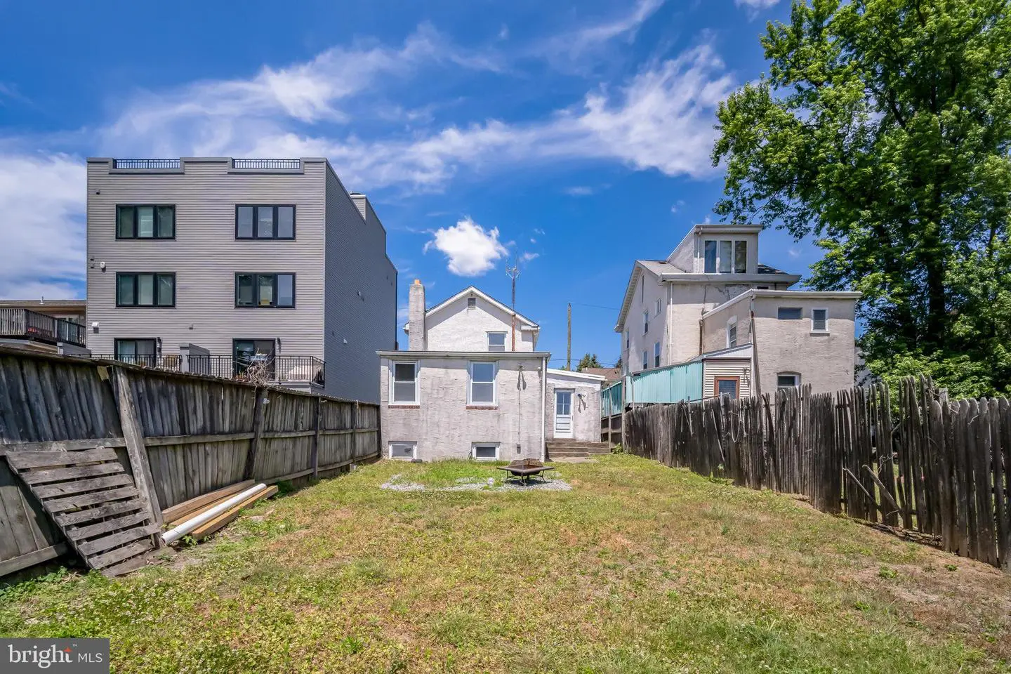 Vacant urban backyard with fences and houses