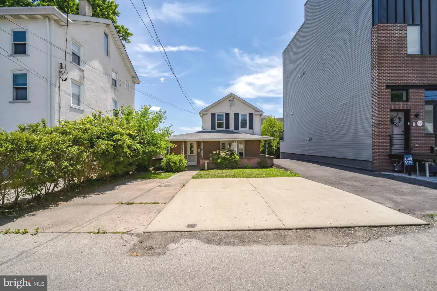 Two-story house with concrete driveway
