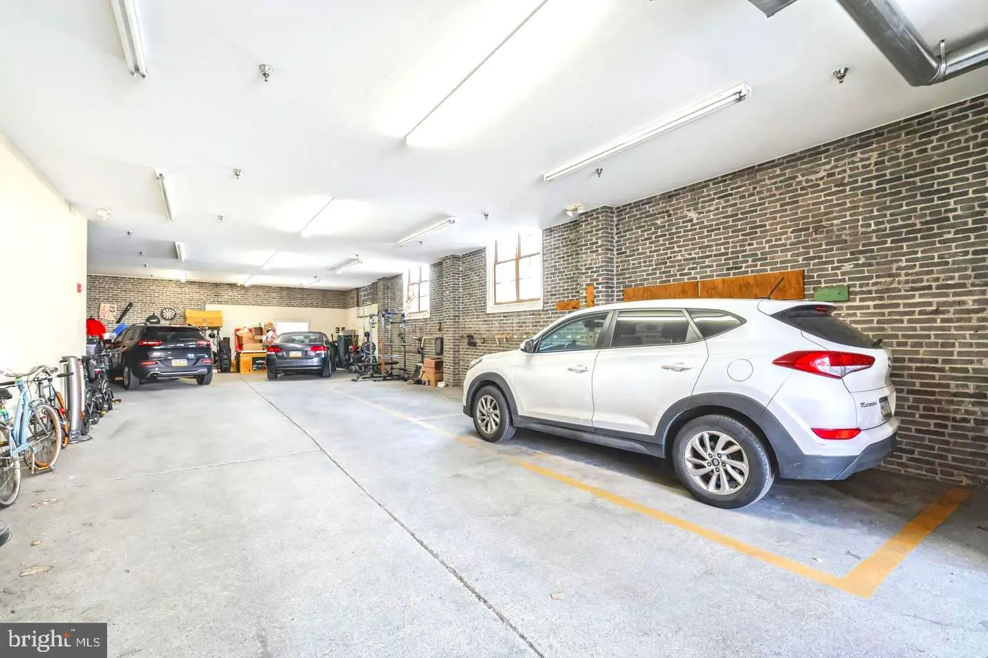 Indoor parking garage with white SUV