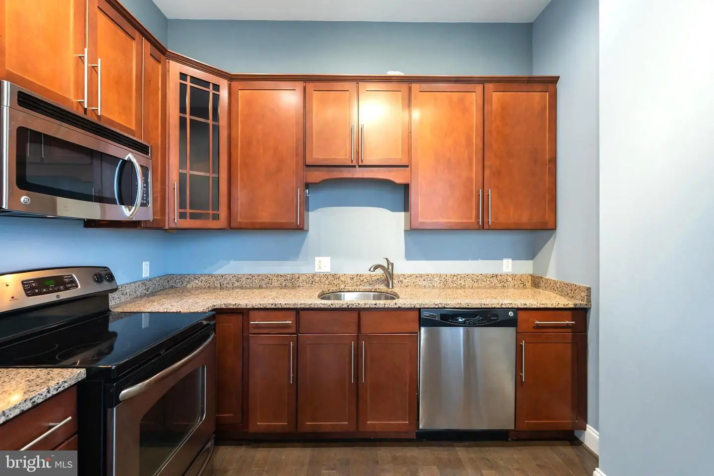 Modern kitchen with wood cabinets and stainless appliances