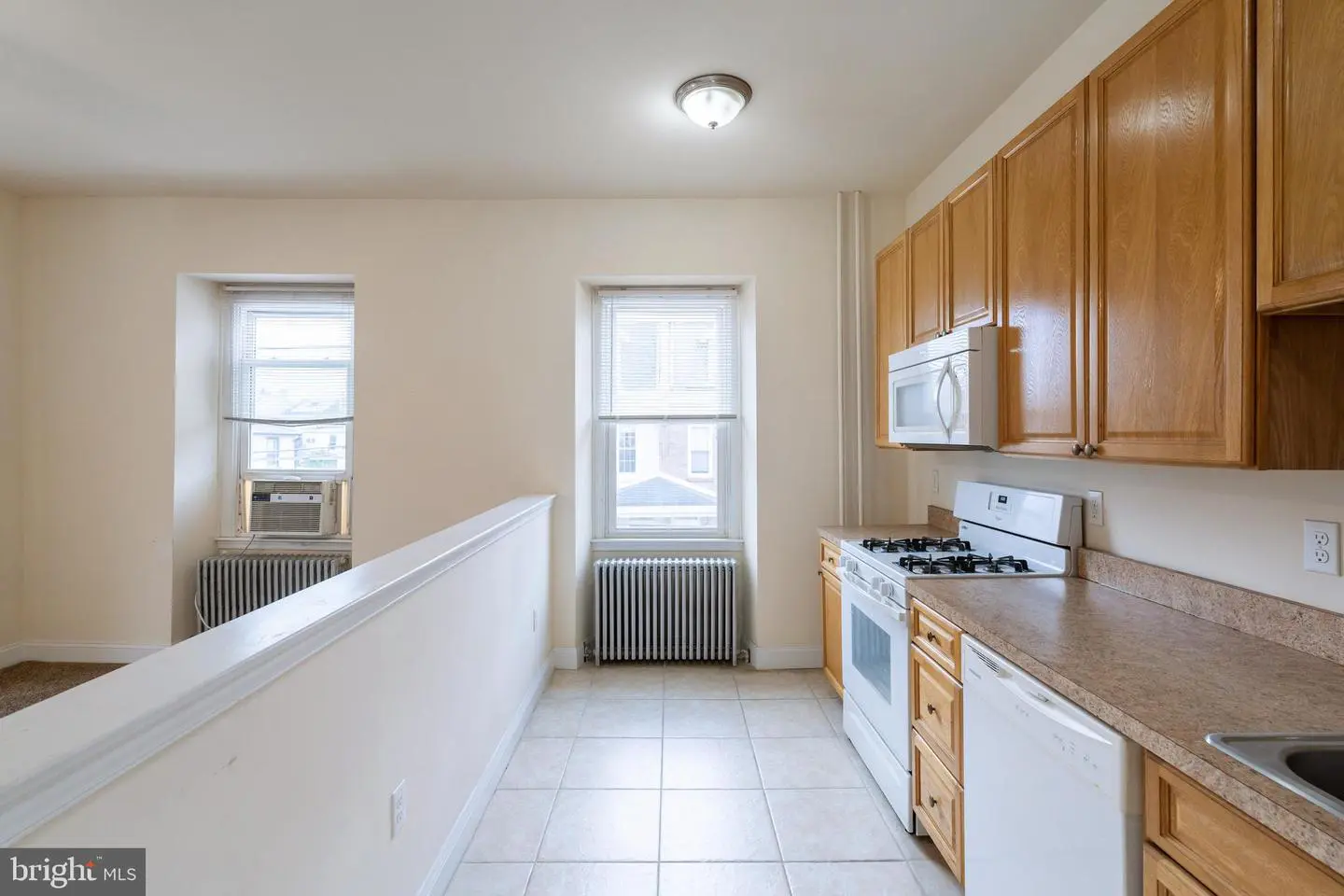 Small galley kitchen with wooden cabinets
