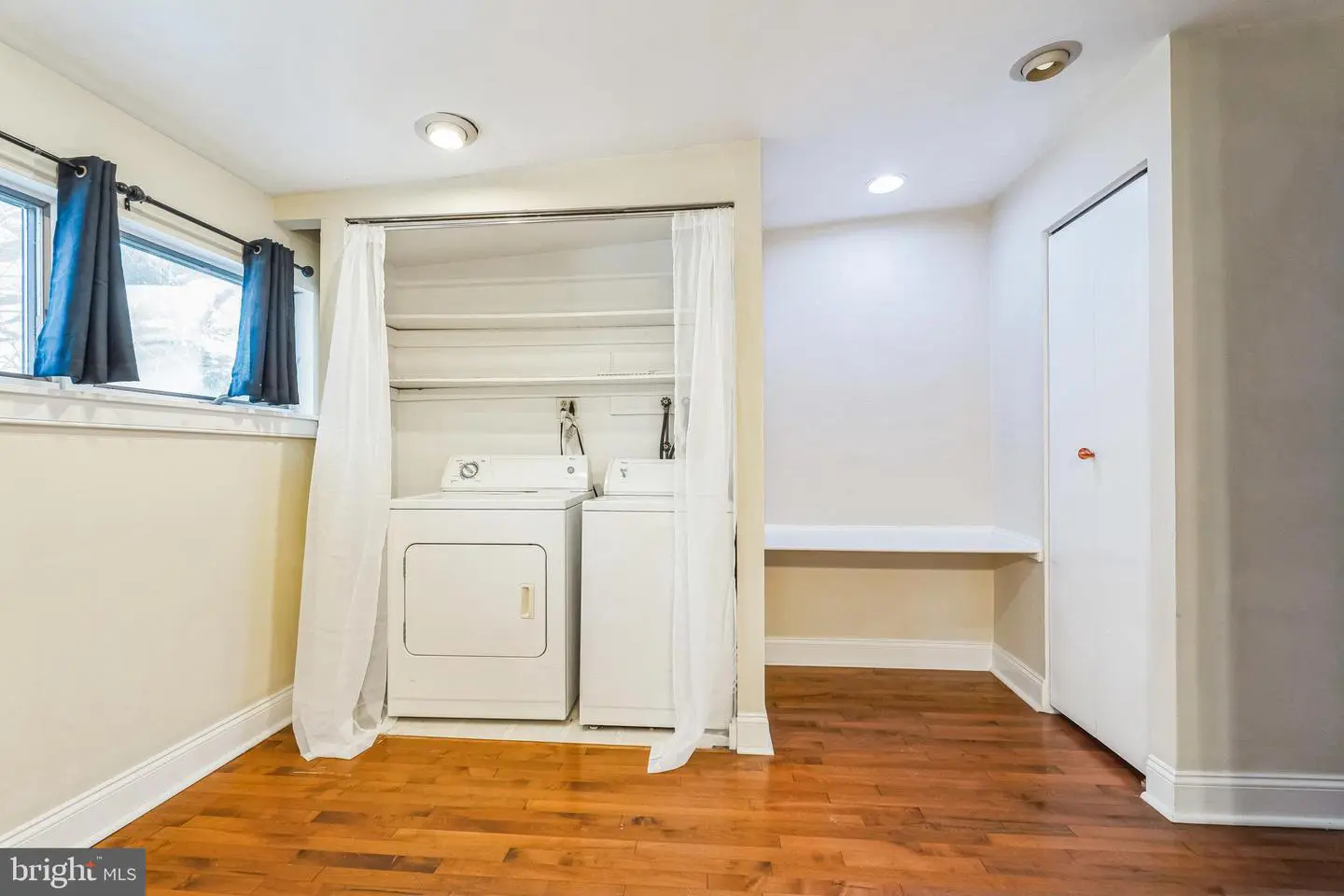 Basement laundry nook with washer and dryer