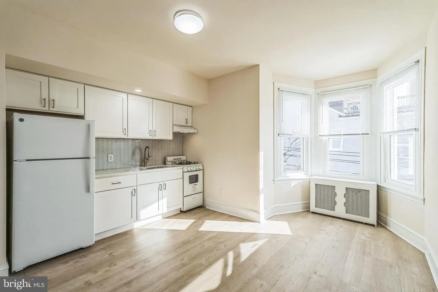 Bright studio kitchen with bay window