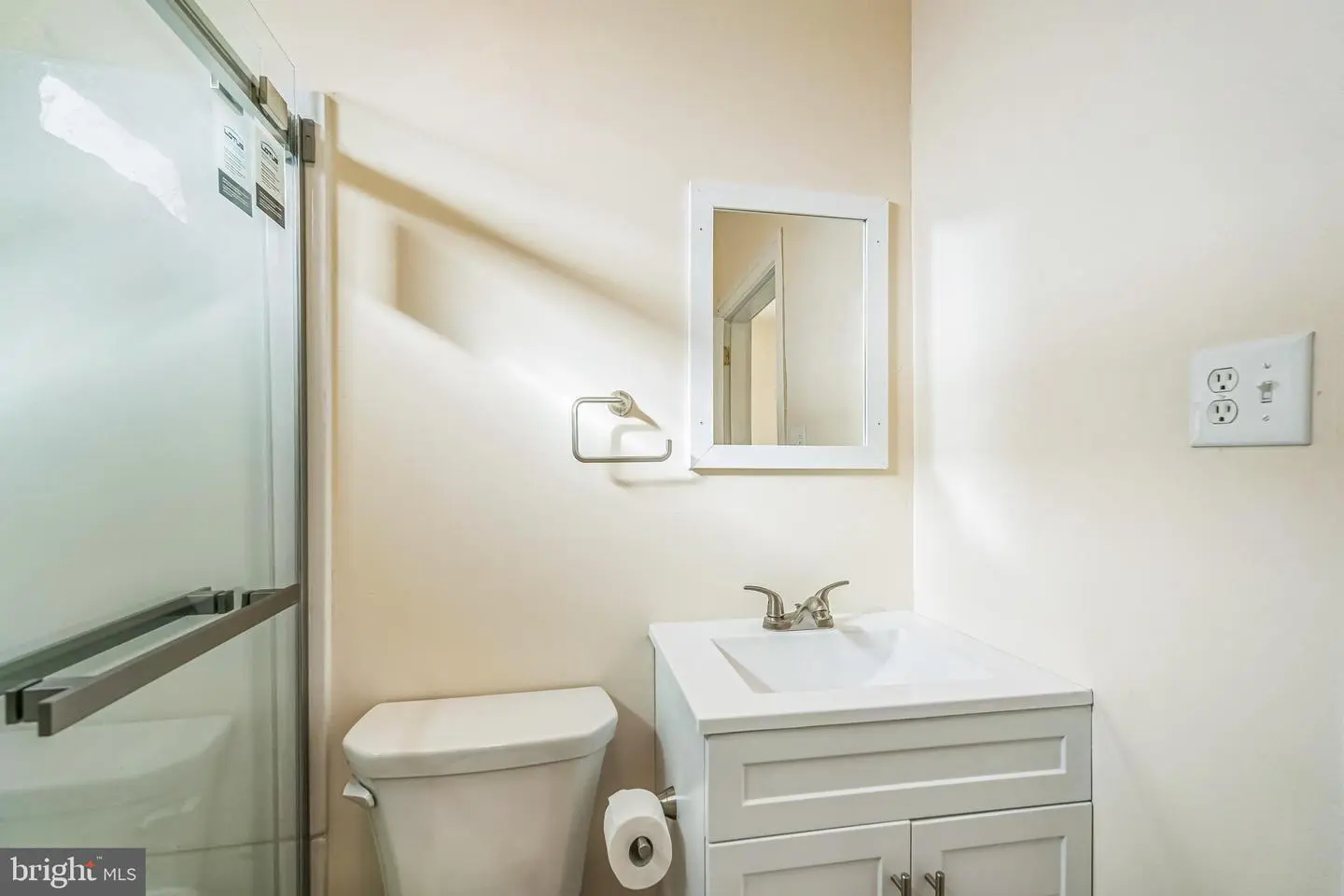 Small bathroom with glass shower and vanity