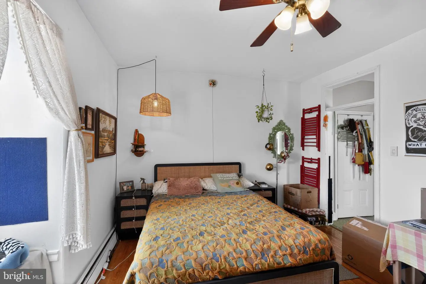 Cozy eclectic bedroom with patterned bedspread